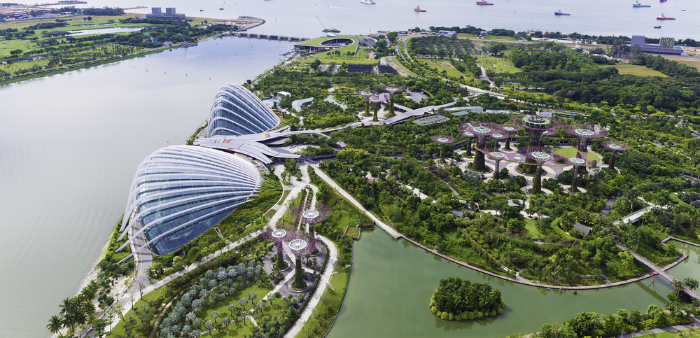 Bird eye of Landscape from bird view of Cargo ships entering one of the busiest ports in the world, over the Garden by the bay in Marina bay sand