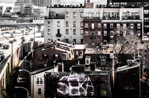 Old buildings and the Delaware Expressway, seen from the Ben Franklin Bridge Walkway in Philadelphia, Pennsylvania.